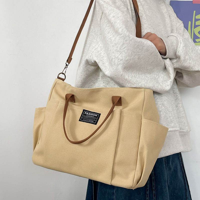 Canvas Tote Designer - กระเป๋าผ้าแคนวาสใบใหญ่สำหรับผู้หญิง, กระเป๋าทำงานสไตล์มินิมอล - กระเป๋าช้อปปิ้งสำหรับเดินทางที่กว้างพิเศษ, กระเป๋าสะพายข้างแบบทนทานสำหรับไปโรงเรียน